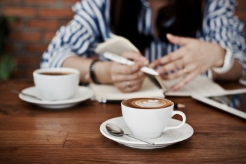 Coffee cup hot in the morning and working at cafe