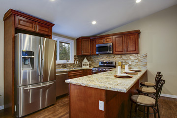 Brown kitchen design with mahogany kitchen cabinets.