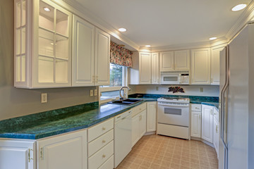 Freshly renovated kitchen room with white cabinetry