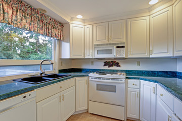 Freshly renovated kitchen room with white cabinetry