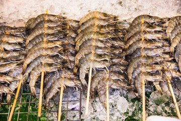  Fresh prawns on ice  in a public street restaurant at Phuket, Thailand.