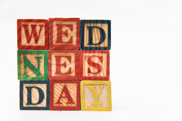 composing letters into one word, "Wednesday".