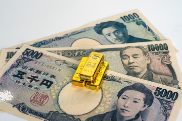日本円と金塊のイメージ