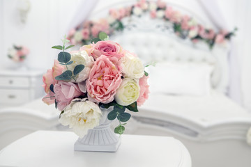 synthetic bouquet in white bedroom decoration