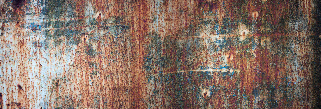 rusty metal texture with flaking paint. panoramic background of old iron and rust