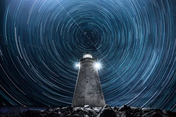 Tuinposter startrails, lighthouse with startrails © Ossa