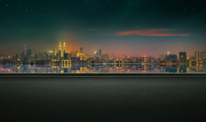 Fototapeta na wymiar Panoramic view of asphalt road side with beautiful Kuala Lumpur city waterfront skyline. Night scene .