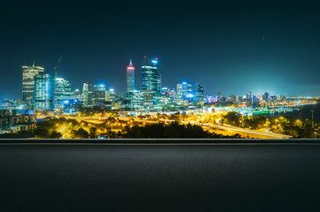 Fototapeta na wymiar Panoramic view of asphalt road side with beautiful Perth city skyline. Night scene .