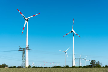 Windwheels and power transmission lines seen in rural Germany