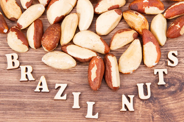 Inscription brazil nuts and fruits containing natural minerals and vitamin