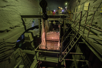 Fototapeta premium Underground iron ore mine shaft tunnel gallery ore crusher room