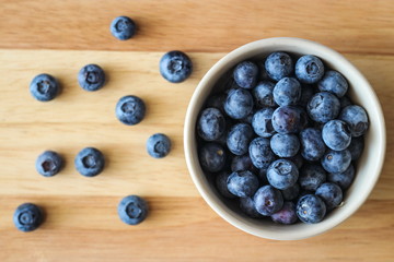 Naklejka na ściany i meble Freshly picked blueberries. Ripe and juicy fresh picked bilberries close up