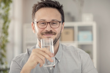 Young man having glass of water