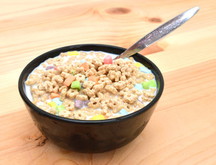 marshmallow kids cereal in bowl on wood background