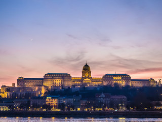 Buda Castle lit up at night in Budapest, Hungary.