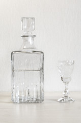 A decanter bottle and a glass of wine