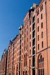 Red brick facade of warehouse buildings in Speicherstadt - the largest historic warehouse district...