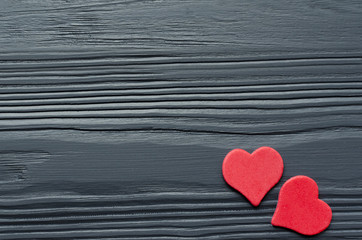 paper red hearts on grey wooden background