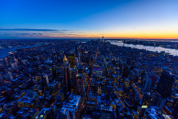 New York City - Manhattan downtown skyline skyscrapers at night - View from Observation Deck on the Empire State Building at twilight. USA.