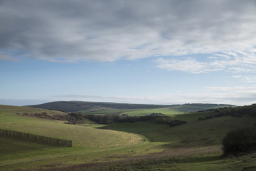Fototapeta na wymiar Stunning English countryside landscape across rolling green hills