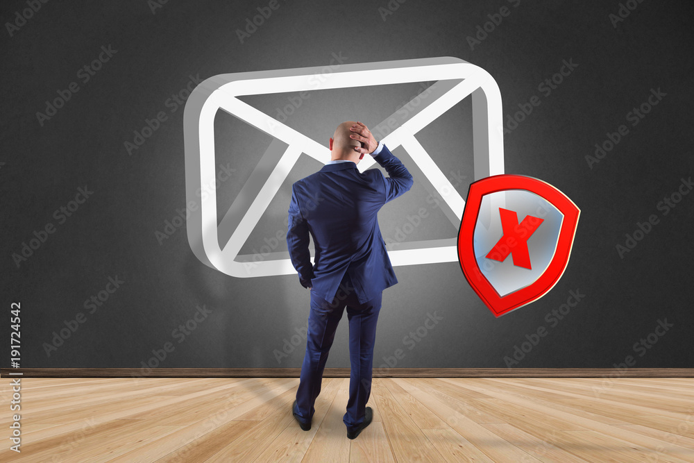 Poster businessman in front of a wall with spam message email symbol displayed on a futuristic interface - 