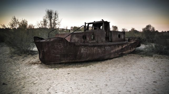 Panorama of ship cemetery at sunset near Moynaq, Karakalpakstan, Uzbekistan