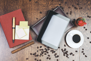 Wooden workplace with empty tablet