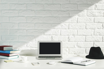 Creative designer workspace with laptop