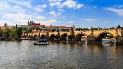 Fototapeta na wymiar View of Charles Bridge and Castle of Prague on a sunny day