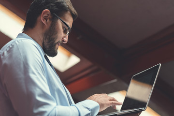 Young businessman with laptop