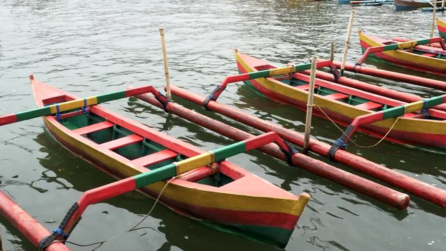 close of boats at ulun danu beratan temple beside lake beratan on the indonesian island of bali