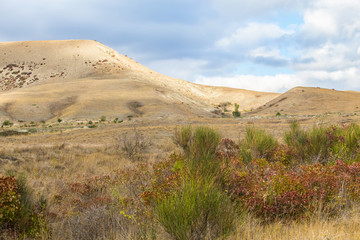 Mountains and hills covered with grass.