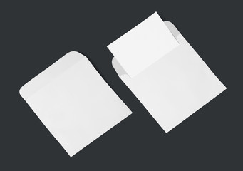 White envelope and post card on a background, top view. Blank envelope mockup and blank letterhead presentation template.