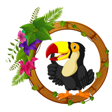 Toucan on round wood frame with flower