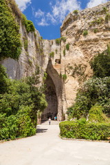 Syracuse, Sicily, Italy. Entrance to the cave "Dionisy's ear" (Orecchio di Dionigi) in the "Paradise" quarries on the territory of the archaeological park of Neapolis