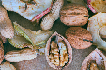 Dry mix of apple, nut and other on wood background in the kitchen