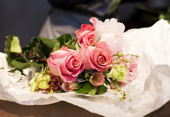 Roses on the florist's table, working moments