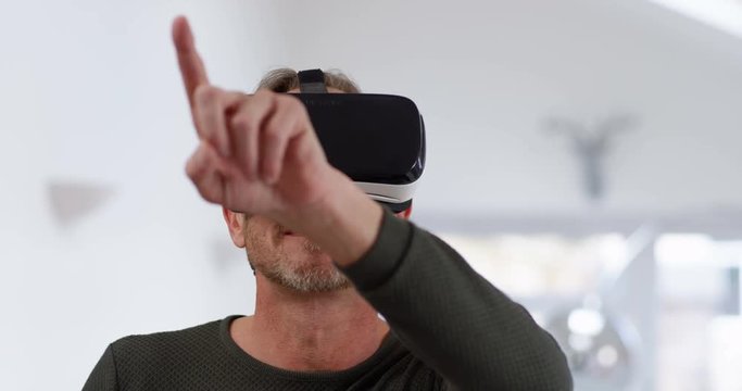 4K Man wearing a virtual reality headset & swiping virtual touchscreen