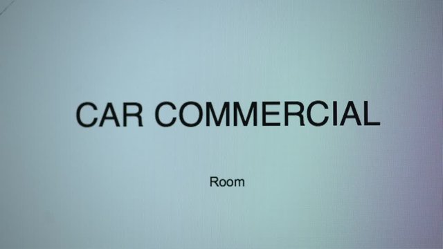 Letters spelling word room typed under phrase car commercial and wiped in text redactor on computer screen, close up