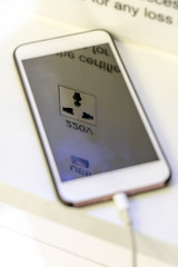 Free battery charging station in the airport for traveler. Phone charging on a table at charging station in the lobby. Free charging on the airport terminal.