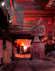 Vintage top casting at steel making plant into ingot moulds for rolling to final shape in a mill.