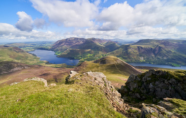 Views of Lake Buttermere and Crummock Water on route to the summit of Red Pike with Wandope, Whiteless Pike, Grasmoor and Robinson in the distance. The English Lake District, UK.