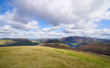 Fototapeta premium Views of Crummock Water from the summit of Red Pike with Little Dodd, Mellbreak and Grasmoor in the distance. The English Lake District, UK.