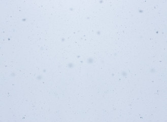 Obraz premium Snowfall. Abstract winter blurred background with flying snow flakes.