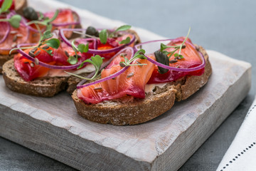 Fish Tapas on Crusty Bread, bread and cured salmon