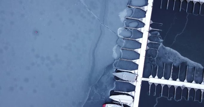 Aerial footage of frozen Frognerkilen Marina in Oslo, Norway in winter 2018