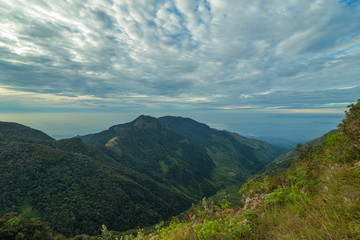 Fototapeta na wymiar Mountains Landscape. Hills skyline Worlds End in Horton Plains National Park Sri Lanka.