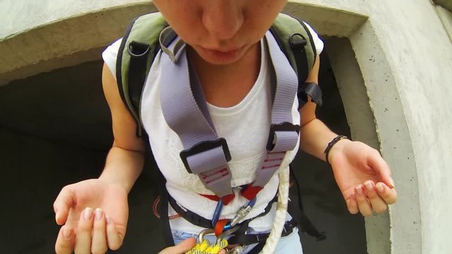 jump from the 15th floor high-rise building with hanging 20 meters above the ground on a system of climbing ropes