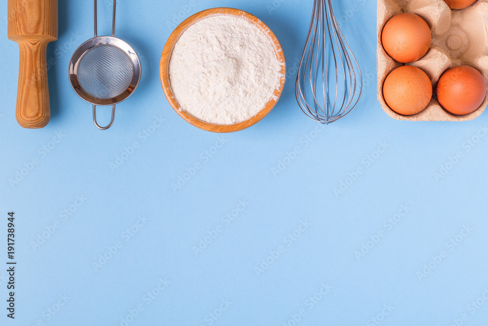 Wall mural ingredients for baking on a blue background.