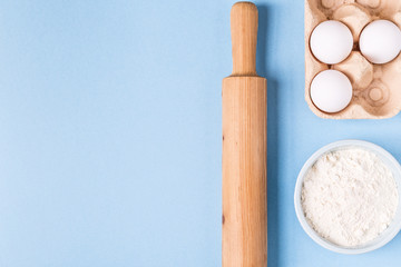 Ingredients for baking  on a blue background.
